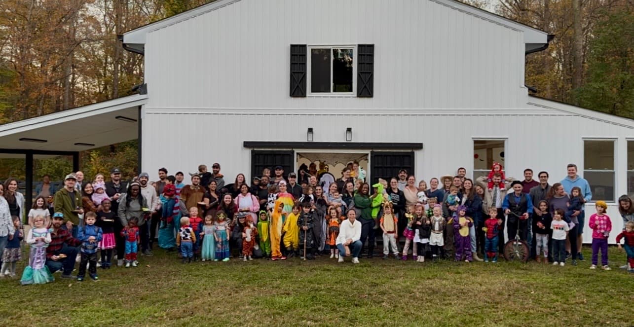 Little Ones families gathered outside for a community celebration